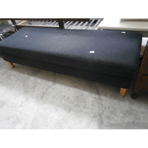 606 - A long upholstered bench seat