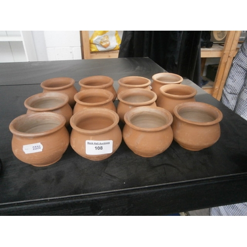 108 - Twelve small terracotta pots