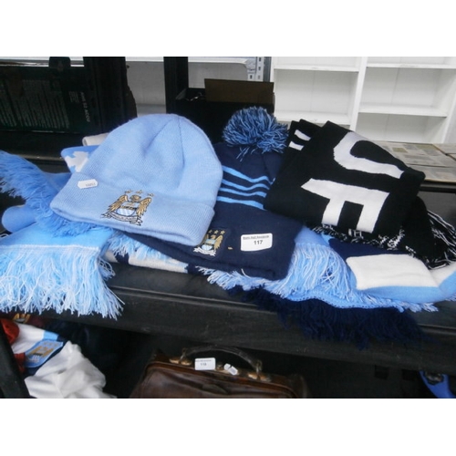 117 - Quantity of Manchester City scarfs and hats with Newcastle united scarf