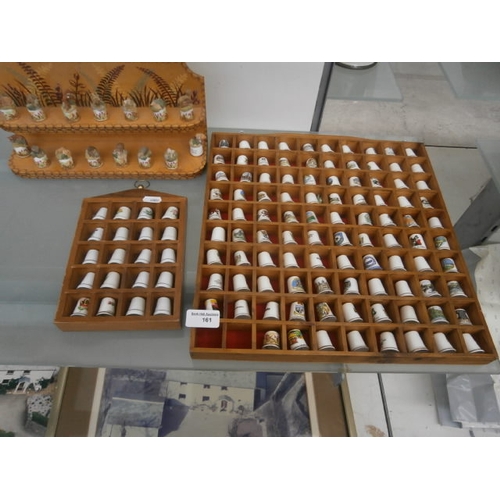 161 - Quantity of thimbles on display stands