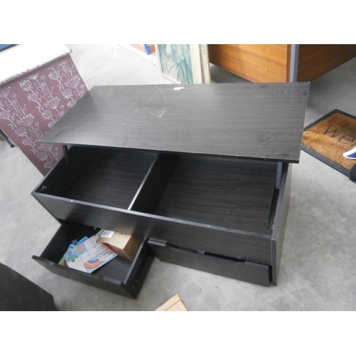 610 - A low coffee table with lift top storage and drawers