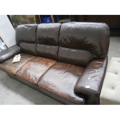 630 - A large vintage leather padded settee