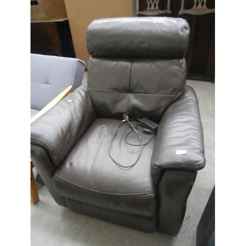 633 - A large faux leather electric recliner armchair