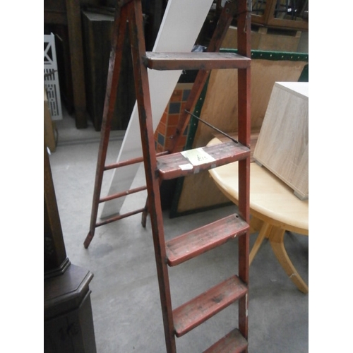 636 - A set of folding metal step ladders