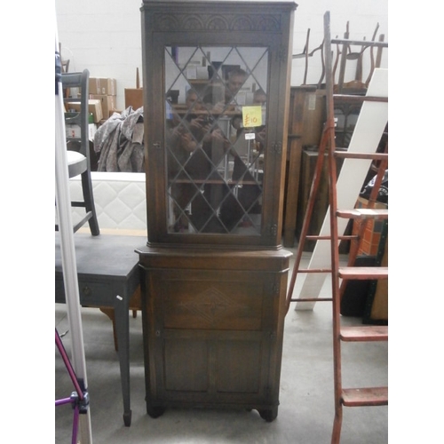 637 - A vintage carved corner cabinet with lead glazed door