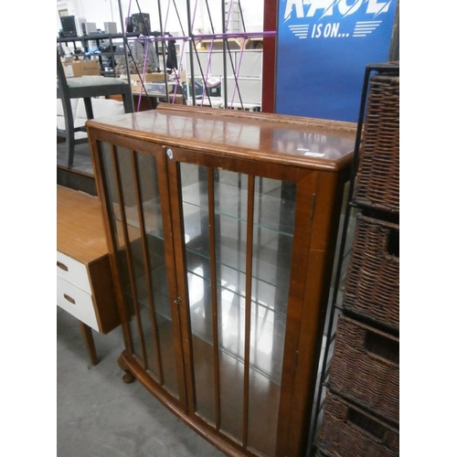 643 - A vintage glazed display cabinet