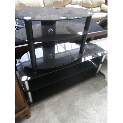 604 - 2 x black glass TV stands