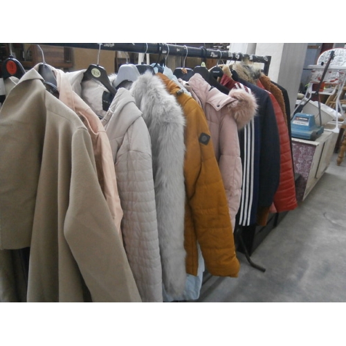 611 - A rail of coats and jackets - rail not included