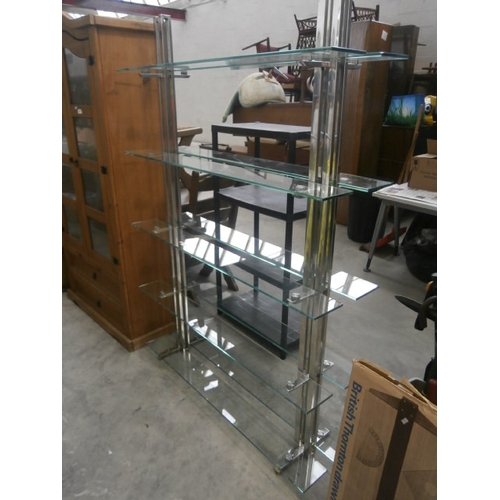 603 - A chrome framed glass shelf stand