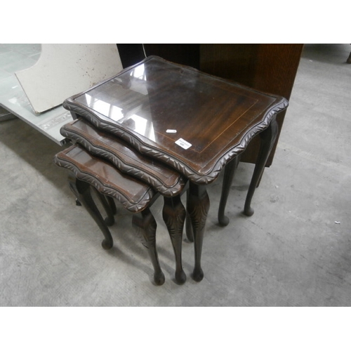 608 - A nest of 3 x vintage mahogany glass topped occasional tables