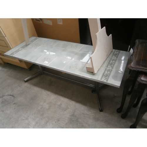 610 - A retro tile topped coffee table with chromed frame