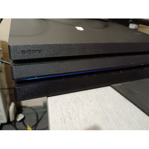 170 - PS4 with controllers and power lead, working and cleaned