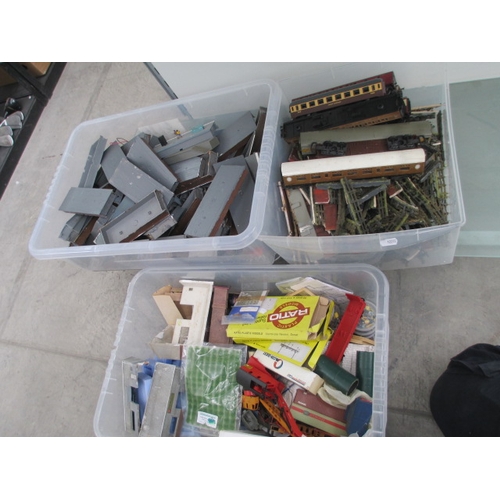 222 - Three boxes of model rail items inc buildings, carriages, figures, etc
