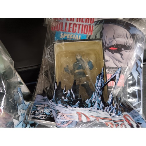 161 - Eight superhero comic magazines with figurines and Disney magazine with figure, Two magazine shave w... 
