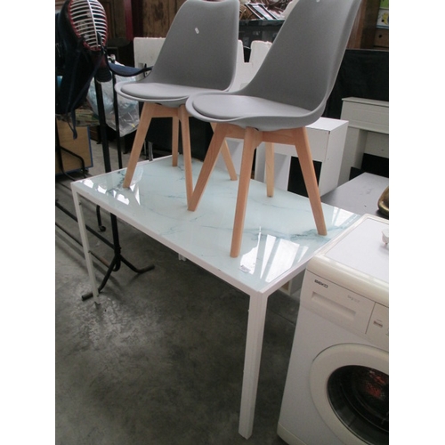 679 - A modern metal framed dining table with marble effect glass top and 2 x modern chairs