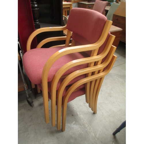 615 - A set of 4 x wood framed stacking office chairs with upholstered seats