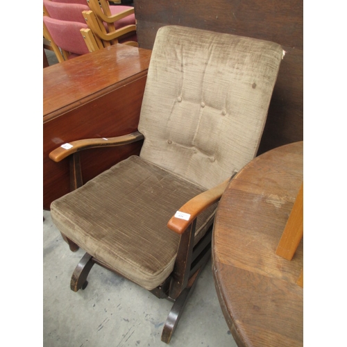 619 - A vintage upholstered wood framed rocking chair