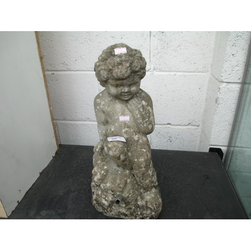 285 - A small cast stone garden figure