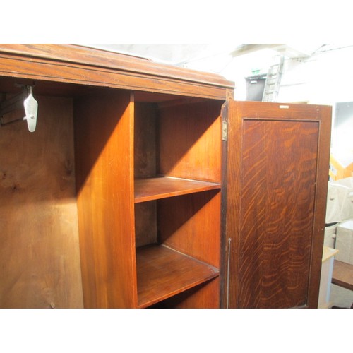 651 - A vintage 2 door oak wardrobe with fitted internal drawers