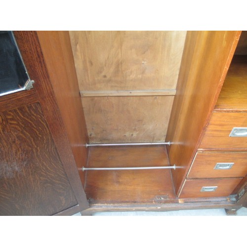 651 - A vintage 2 door oak wardrobe with fitted internal drawers