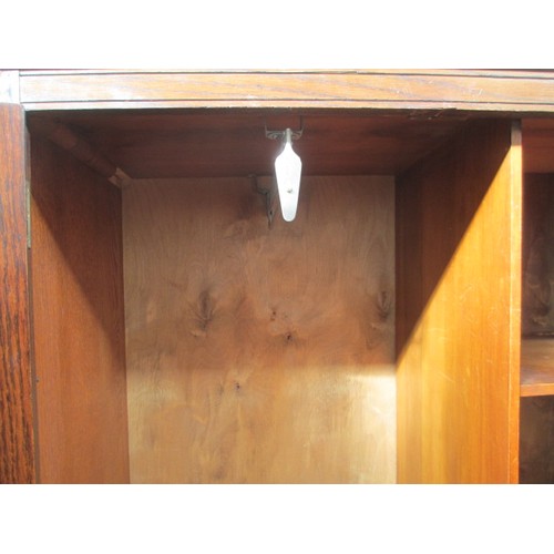 651 - A vintage 2 door oak wardrobe with fitted internal drawers