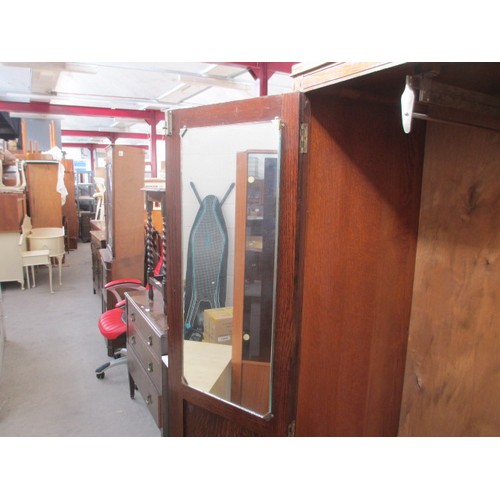 651 - A vintage 2 door oak wardrobe with fitted internal drawers