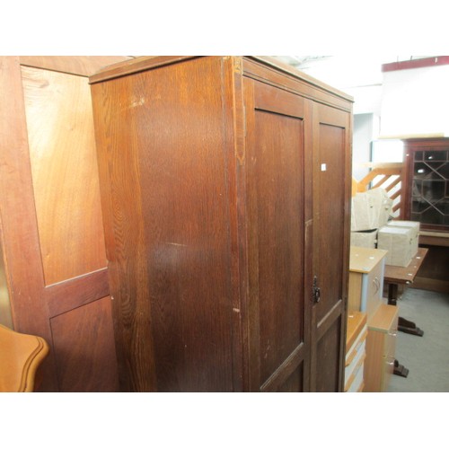 651 - A vintage 2 door oak wardrobe with fitted internal drawers