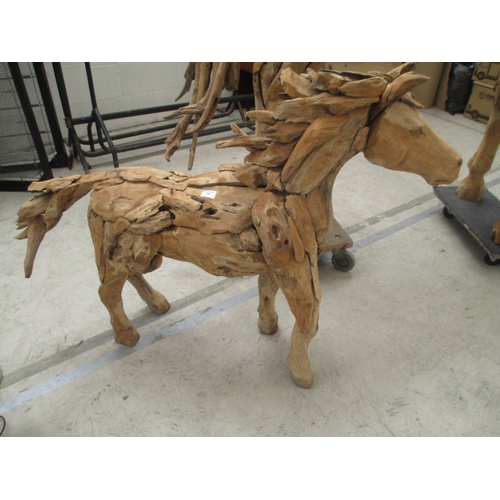 298 - Ornately carved wooden horse. Size Length 50