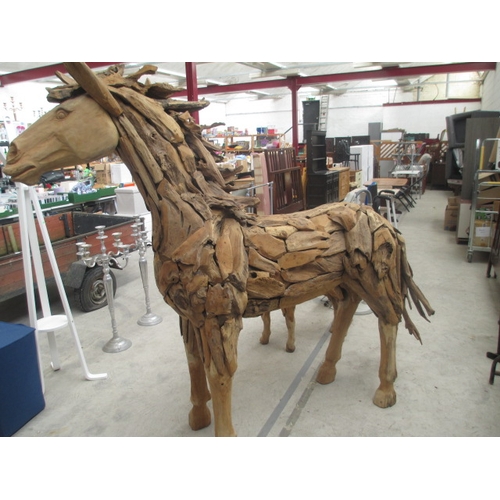 299 - Full sized ornately carved wooden horse. Size Length 88