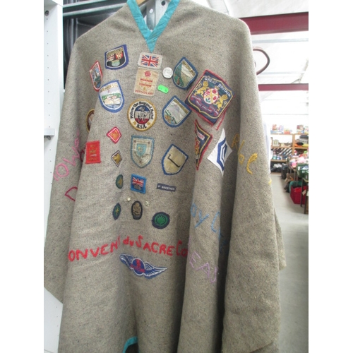 323 - Girl guides cape covered in assorted fabric badges