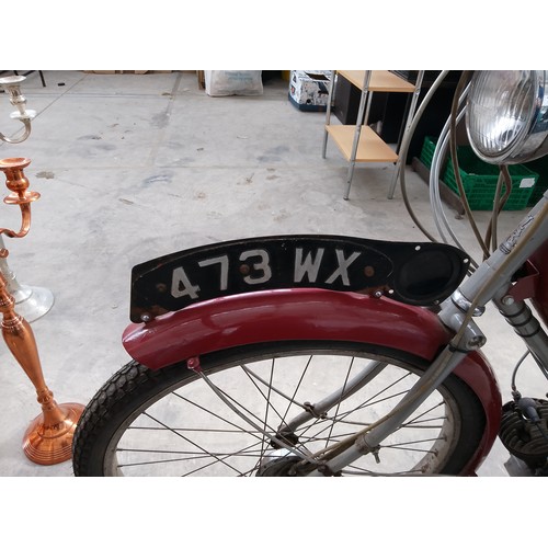 300 - Vintage The Raleigh 50cc bike with Sturmey Archer engine and original reg plate. In very good condit... 