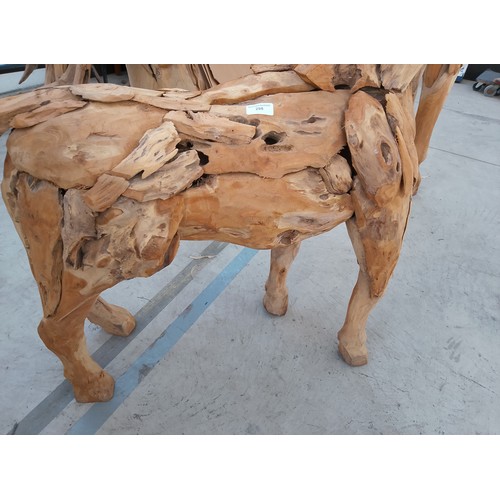 298 - Ornately carved wooden horse. Size Length 50