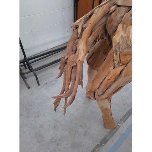 299 - Full sized ornately carved wooden horse. Size Length 88