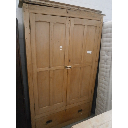 653 - A large vintage pine double wardrobe with large lower drawer