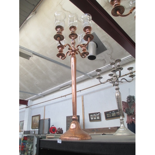 206 - Five arm Rose Gold coloured candelabra with storm glasses