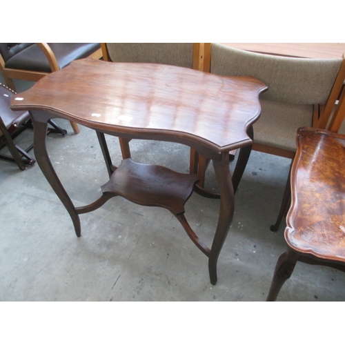 606 - A vintage 2 tier shaped mahogany window table