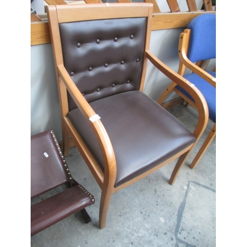 608 - A wood framed elbow chair with faux leather seat pads