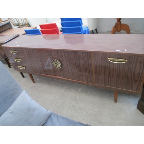 619 - A long retro gloss finished 3 drawer cocktail sideboard