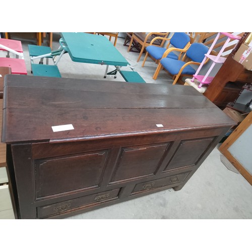 628 - A large Antique Oak lift top coffer with 2 x lower drawers and ornately carved rear panels