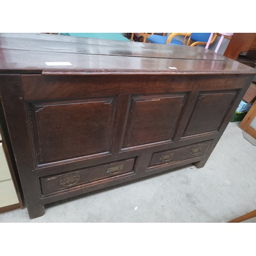 628 - A large Antique Oak lift top coffer with 2 x lower drawers and ornately carved rear panels