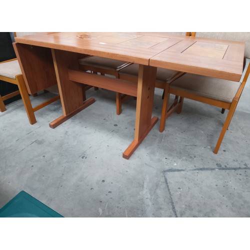 610 - A retro FARSTRUP Danish dining set with large tile top drop leaf table and 6 x chairs