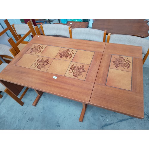 610 - A retro FARSTRUP Danish dining set with large tile top drop leaf table and 6 x chairs