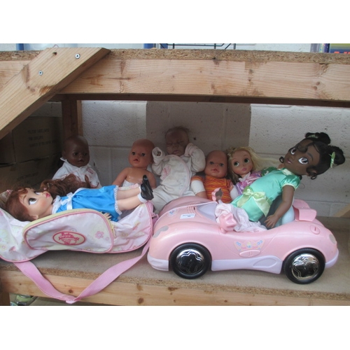 26 - Seven assorted dolls and toy car