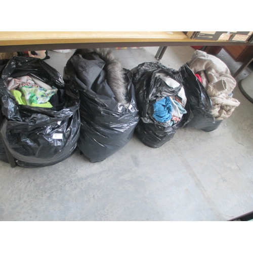 60 - Four bags of assorted clothing