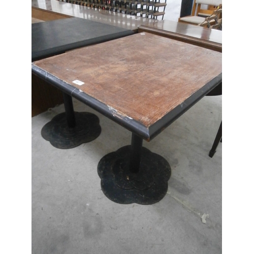 634 - A vintage square pub style table on metal pedestal