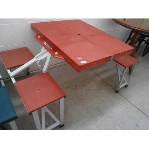 637 - A folding portable picnic table and chairs unit