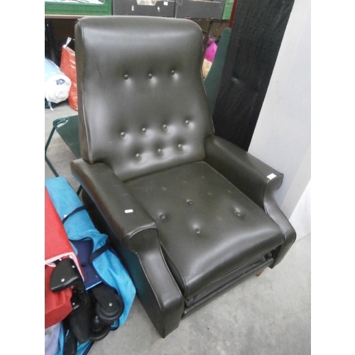 609 - A buttoned faux leather recliner armchair - missing several buttons