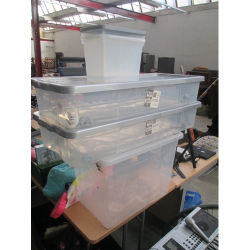 134 - Four plastic storage boxes