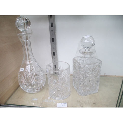 366 - Two decorative decanters and glass tankard