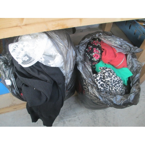 32 - Two bags of assorted clothing